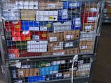 a large metal cart with many boxes of food on it