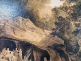 a painting of a group of people in a cave