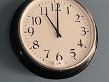 a clock that is on the wall with numbers on it