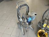 a machine that is sitting on the floor next to a bucket