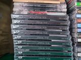 a lot of cds stacked on top of each other