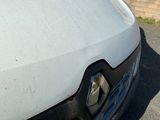 a close up of a car ' s front bumper with the hood up