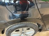 a man taking a picture of his reflection in the mirror of a car