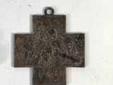 a cross with a lion on it on a white surface