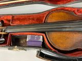 a violin that is sitting in a case on a table