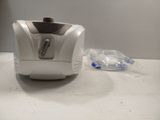 a small blender sitting on a counter next to a bottle of water