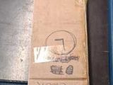 a cardboard box sitting on top of a wooden table