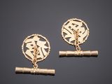 a pair of gold plated earrings with initials and a chain