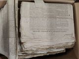 a box full of old newspapers sitting on a table
