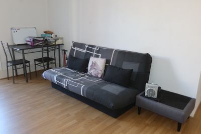 an image of a living room with a couch and a table
