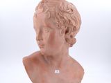 marble bust of a young boy with curly hair