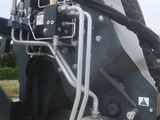 a large machine that is parked on the side of the road