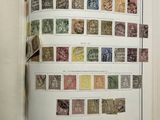 an open book with a bunch of stamps on it