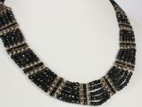 a close up of a necklace on a mannequin mannequin