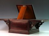 a wooden table with a drawer on top of it