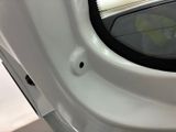 a small hole in the side of a car door