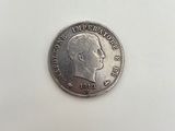 a close up of a coin on a white surface