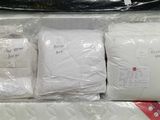 four bags of bedding and a pillow in a box