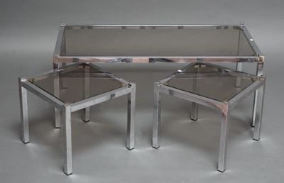 pair of chrome and glass side tables with a glass top