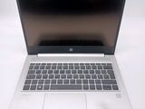 a laptop computer that is sitting on a white table