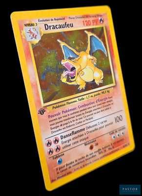 a yellow pokemon card with a picture of a dragon on it