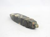 a piece of stone that is sitting on a white surface
