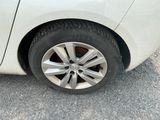 a close up of a car ' s tire on the road