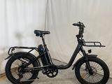 an image of an electric bike parked in front of a white curtain