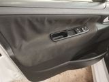 the interior of a car with the door open showing the inside of it