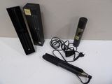 a hair dryer and a box of hair products on a table