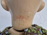 a mannequin head with a bow tie on it