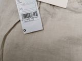 the back of a pair of pants with a price tag on it