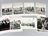 several old black and white photos of people and vehicles in a field