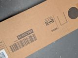 a cardboard box with a barcode on it on a table