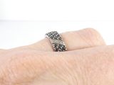 a close up of a person ' s hand with a ring on it