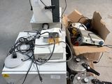 a pile of appliances sitting on a pallet in a room