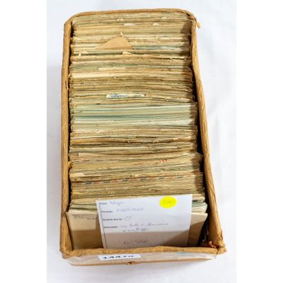 a box filled with lots of papers sitting on top of a table