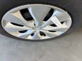 the tire of a car with a sticker on it ' s rim