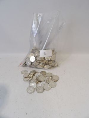 a bag full of coins sitting on a table