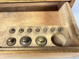 a wooden box that has a bunch of buttons in it
