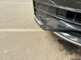 a close up of a car ' s front bumper