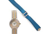 a close up of a wrist watch with a blue strap