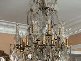 a chandelier hanging from the ceiling in a room