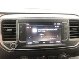a radio in the center of a car that is on the dashboard