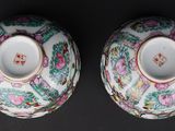 pair of chinese famille vases with flowers and birds on them