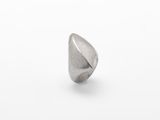 a close up of a silver ring on a white surface