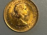 a close up of a gold coin with a woman ' s face on it