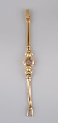 an image of a gold wrist watch with a brown face