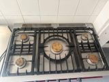 four burners on the stove in the kitchen