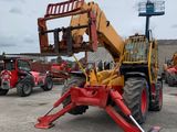 a picture of a red and yellow forklift in a parking lot